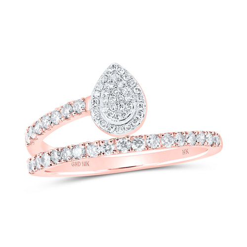 rose gold Pear-shaped diamond cluster with a diamond twist band that elegantly connects to the left side of the ring, creating a unique and sophisticated design