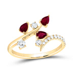 Elegant ring featuring three pear-shaped rubies with three single round diamonds, set in a beautifully intricate design