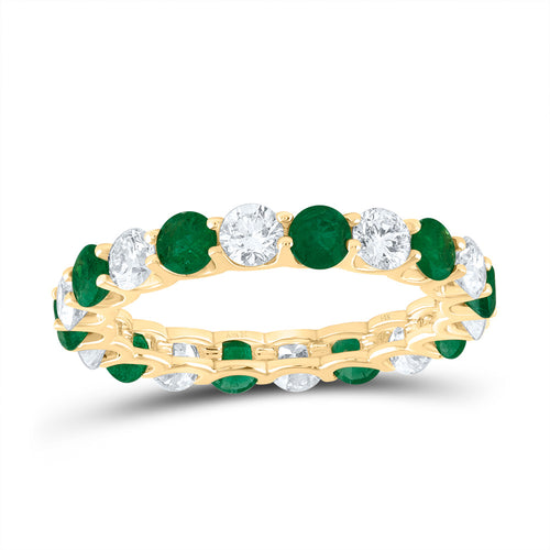 Ring featuring alternating emerald and white diamonds all across the band, creating a vibrant and elegant design