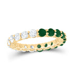 Eternity band featuring emeralds on one half and diamonds on the other, creating a beautiful contrast and timeless design