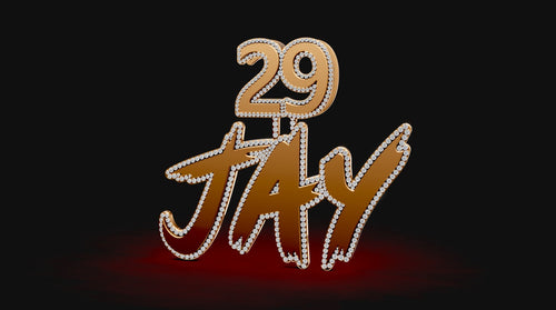 Custom gold and diamond pendant spelling 'Jay' with the number 29 on top, displayed on a black and red background.