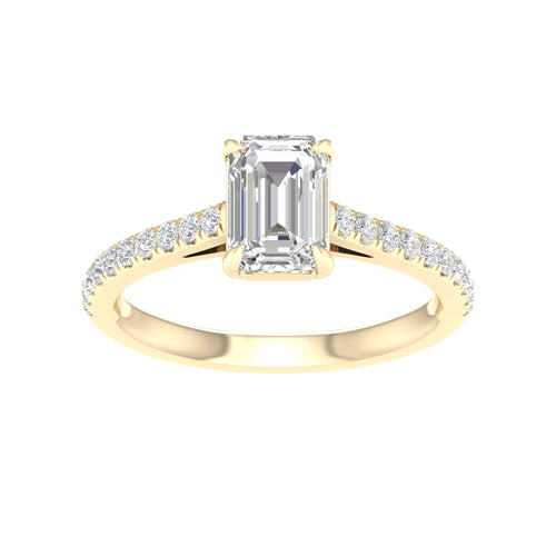 yellow gold ring with pear shaped center stone