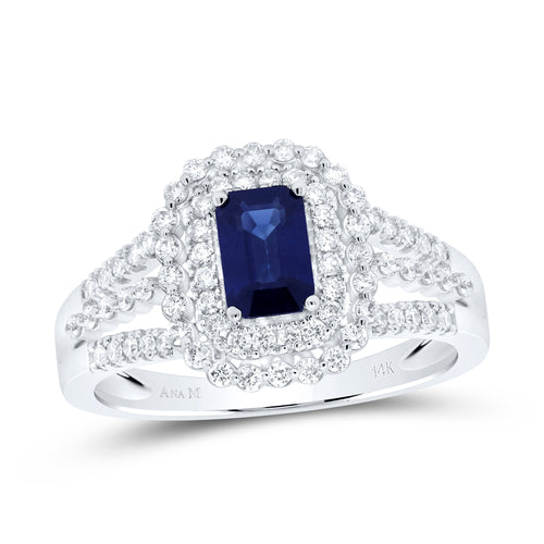 A close-up of a white gold ring featuring a blue sapphire gemstone at the center, surrounded by small, sparkling diamonds. 